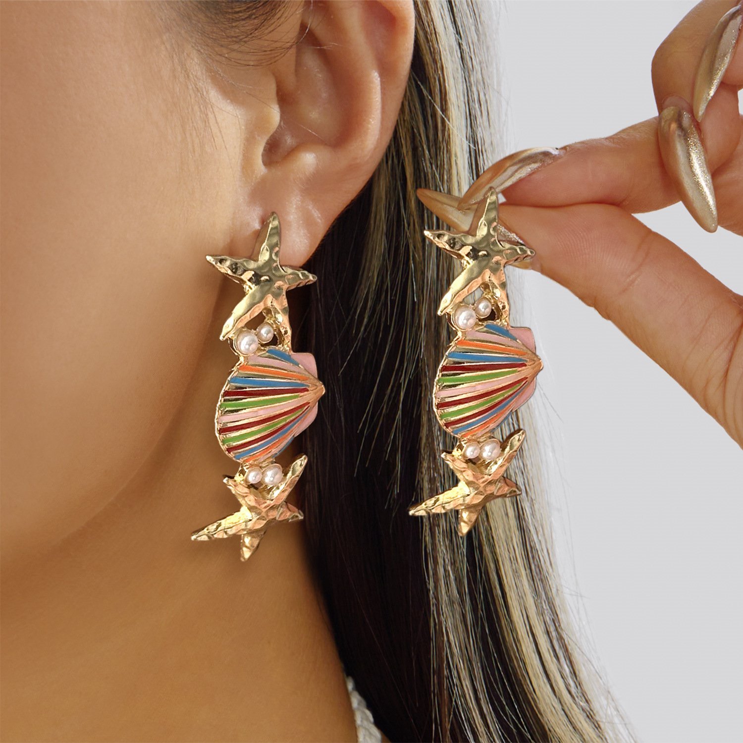 gold starfish shell earrings