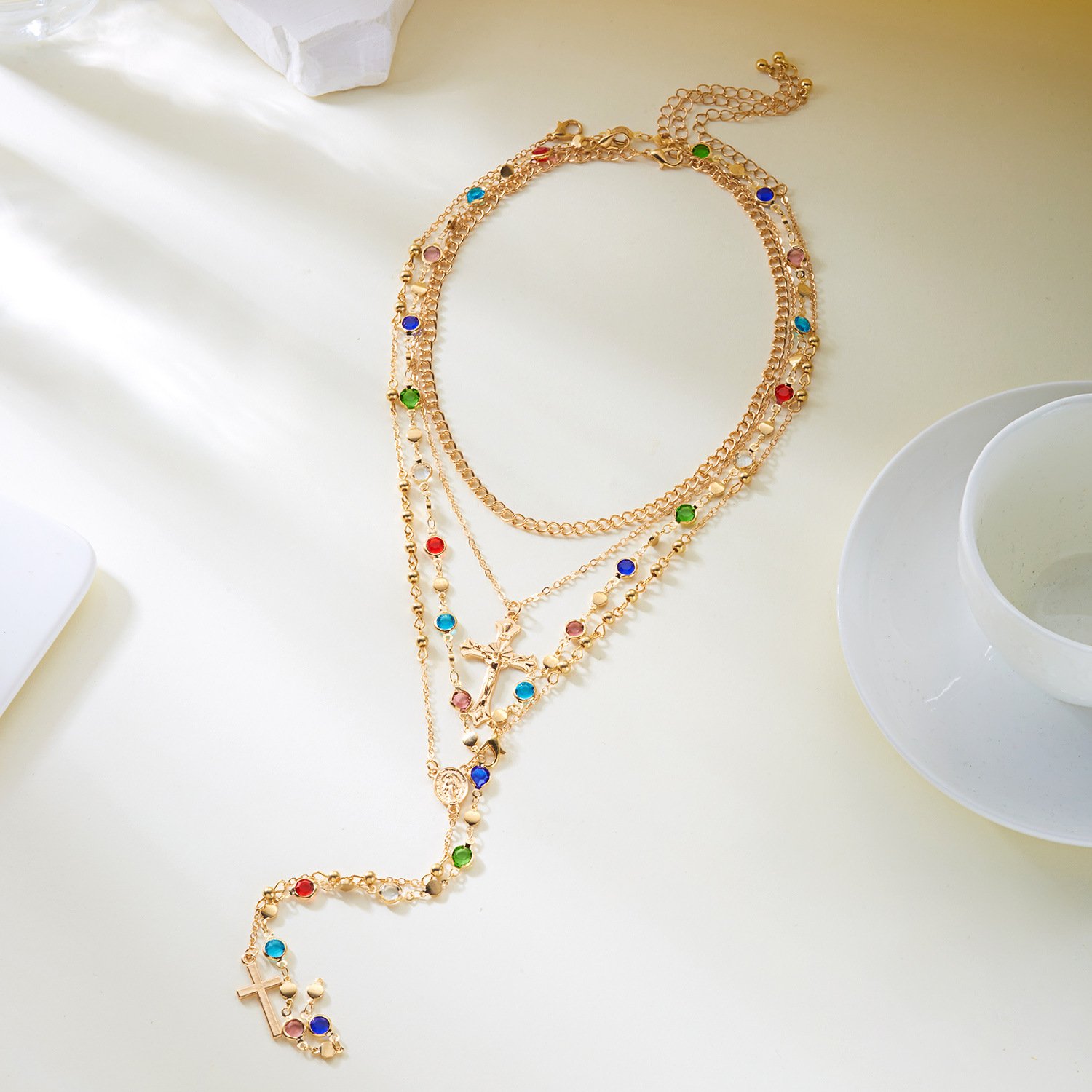 layered gold cross necklace