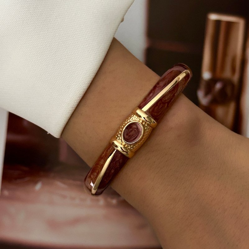 Brown and cream enamel cuff bracelet with gold-tone geometric details
