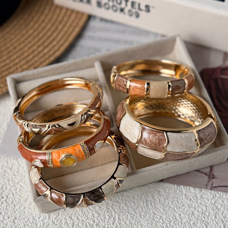 Brown and cream enamel cuff bracelet with gold-tone geometric details