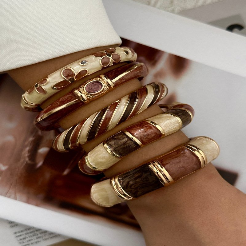 Brown and cream enamel cuff bracelet with gold-tone geometric details