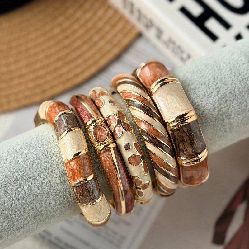 Brown and cream enamel cuff bracelet with gold-tone geometric details